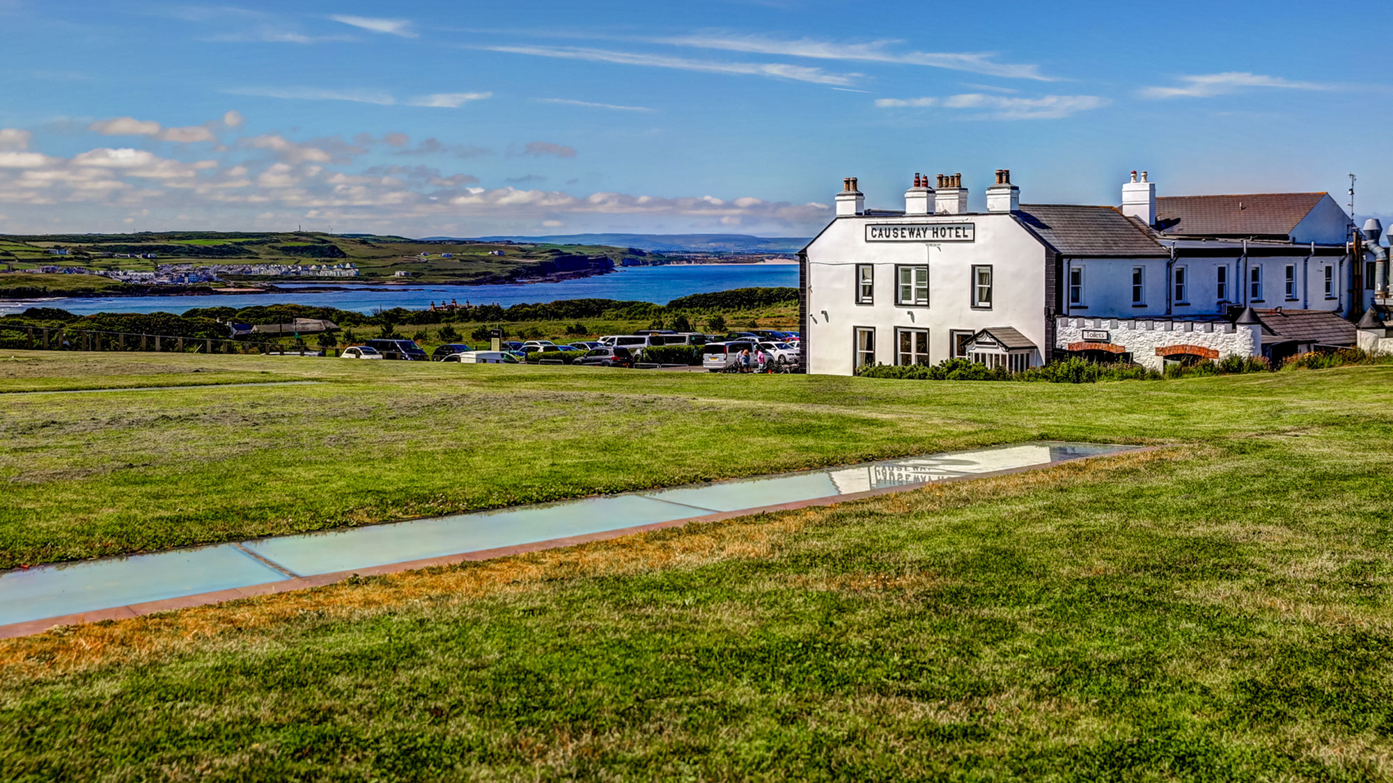 Causeway Hotel with coastline in the background